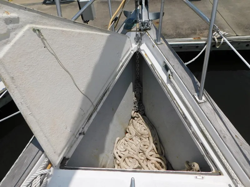 Slide: The Image of Anchor locker of 1984 Endeavour 35.5 Sloop with coiled rope and chain. - 23