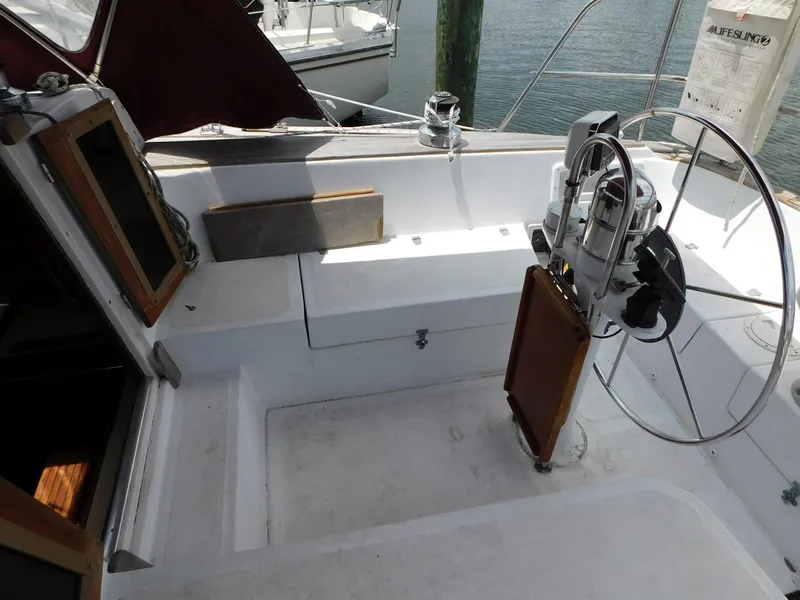 Slide: The Image of Cockpit of 1984 Endeavour 35.5 Sloop with steering wheel and open hatch. - 32