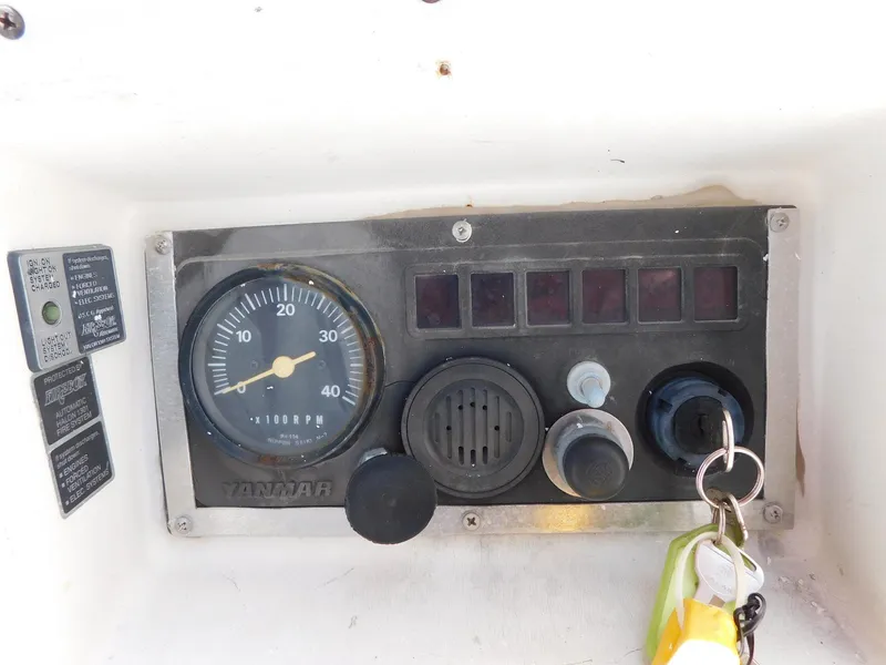 Slide: The Image of Control panel of 1984 Endeavour 35.5 Sloop with Yanmar tachometer and ignition keys. - 36