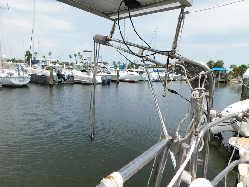 Slide: The Image of 1984 Endeavour 35.5 Sloop in marina, surrounded by boats and calm water. - 39