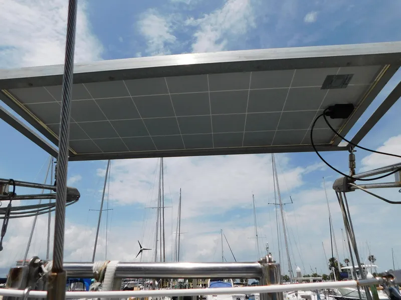 Slide: The Image of Solar panel on 1984 Endeavour 35.5 Sloop sailboat under a cloudy sky. - 40