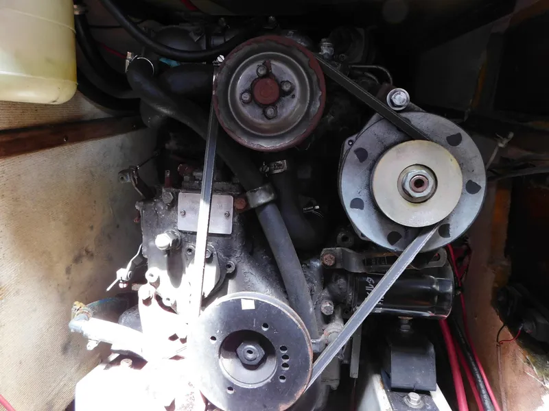 Slide: The Image of Engine compartment of 1984 Endeavour 35.5 Sloop with visible belts and pulleys. - 42