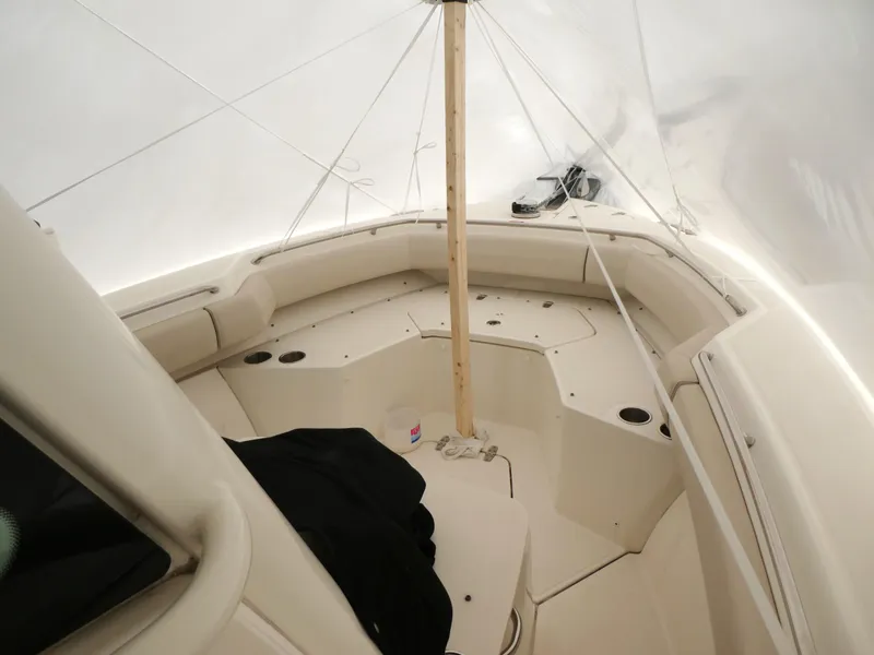 Slide: The Image of 2017 Boston Whaler 250 Outrage boat interior under protective cover. - 10
