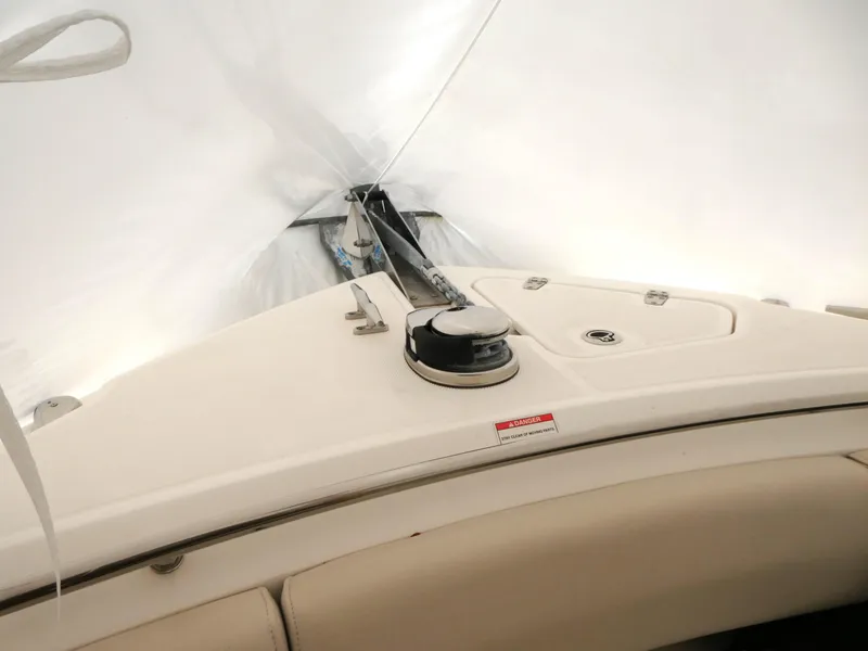 Slide: The Image of 2017 Boston Whaler 250 Outrage boat deck under protective cover. - 13
