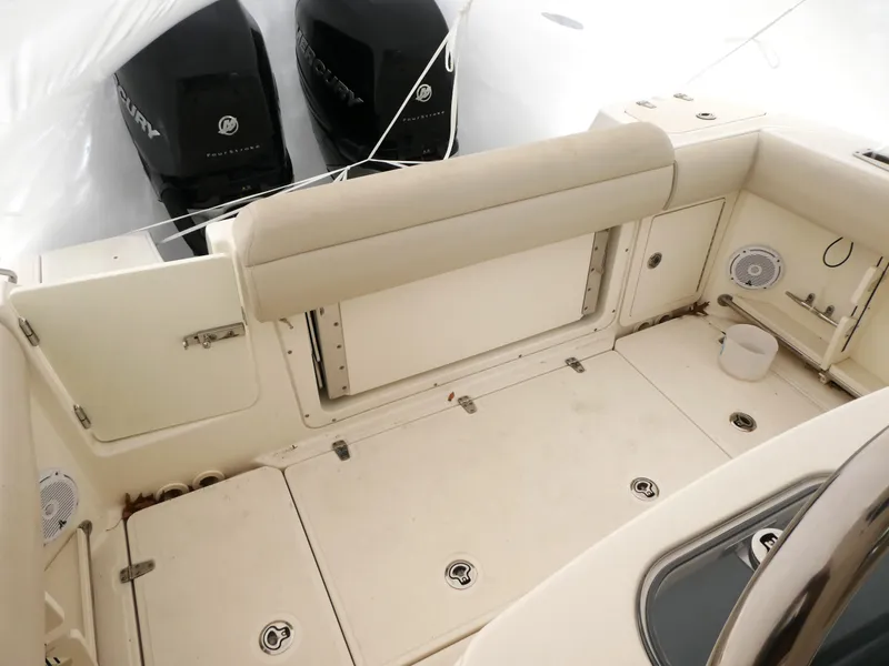 Slide: The Image of 2017 Boston Whaler 250 Outrage boat interior with dual Mercury engines. - 4