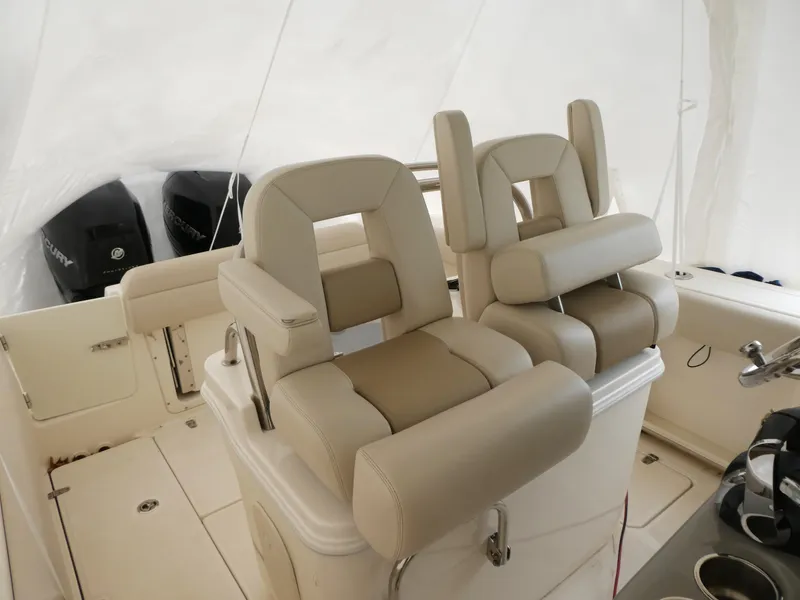 Slide: The Image of 2017 Boston Whaler 250 Outrage boat interior with dual cushioned seats. - 7