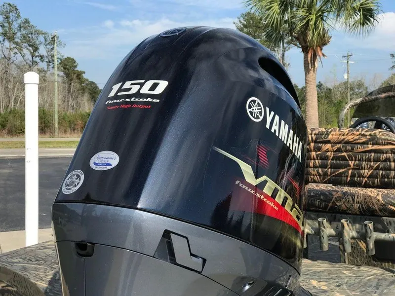 Slide: The Image of Yamaha 150 outboard motor on War Eagle Blackhawk 2170, 2025 model, with palm trees in background. - 11
