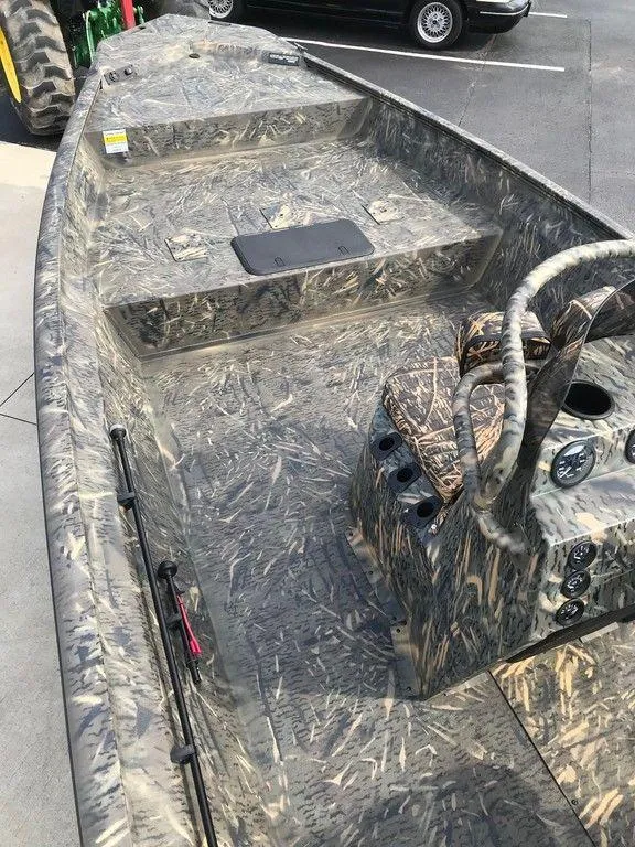 Slide: The Image of 2025 War Eagle Blackhawk 2170 boat with camouflage interior design. - 3
