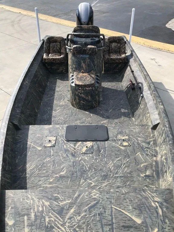 Slide: The Image of 2025 War Eagle Blackhawk 2170 boat with camo design and spacious interior. - 7