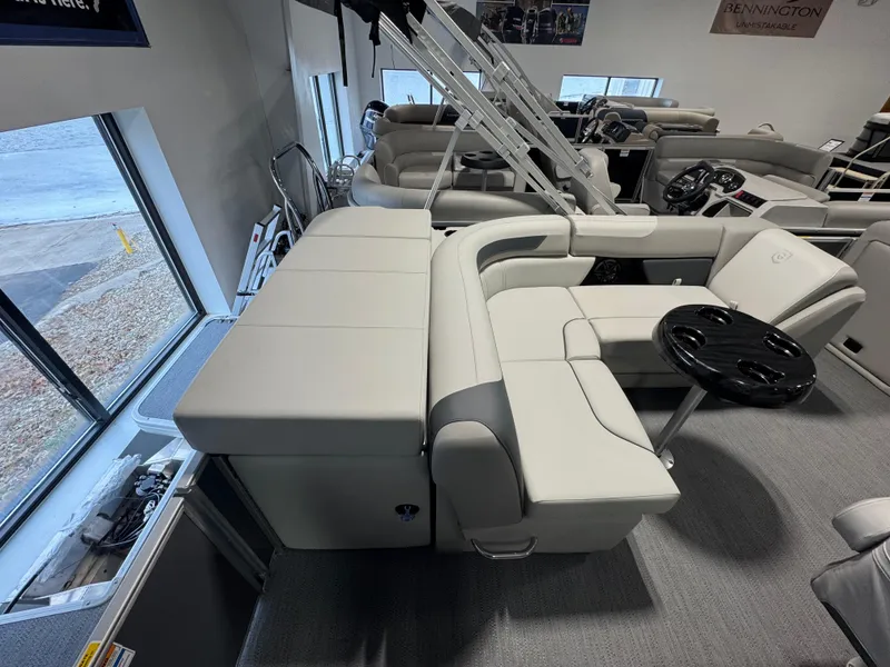 Slide: The Image of 2025 Godfrey Sweetwater 2086 C pontoon boat interior with plush seating and table. - 10