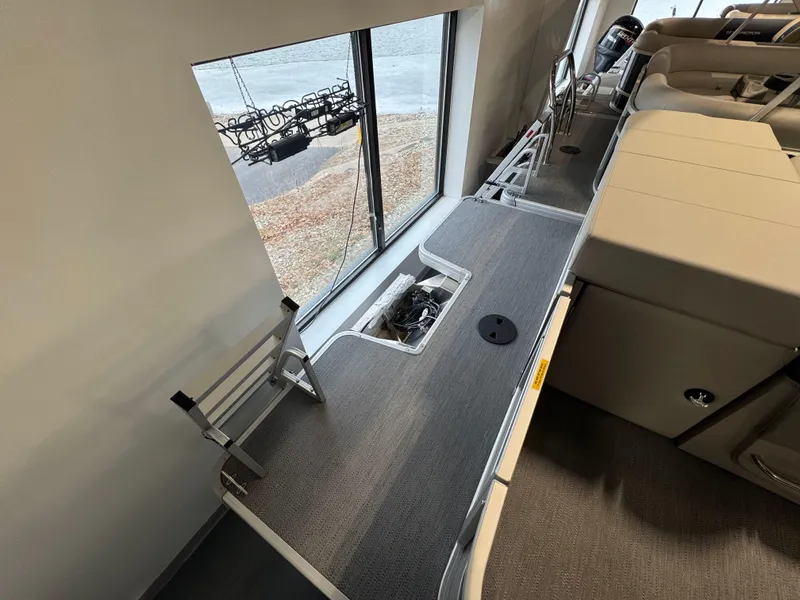 Slide: The Image of 2025 Godfrey Sweetwater 2086 C pontoon boat interior with seating and storage. - 12