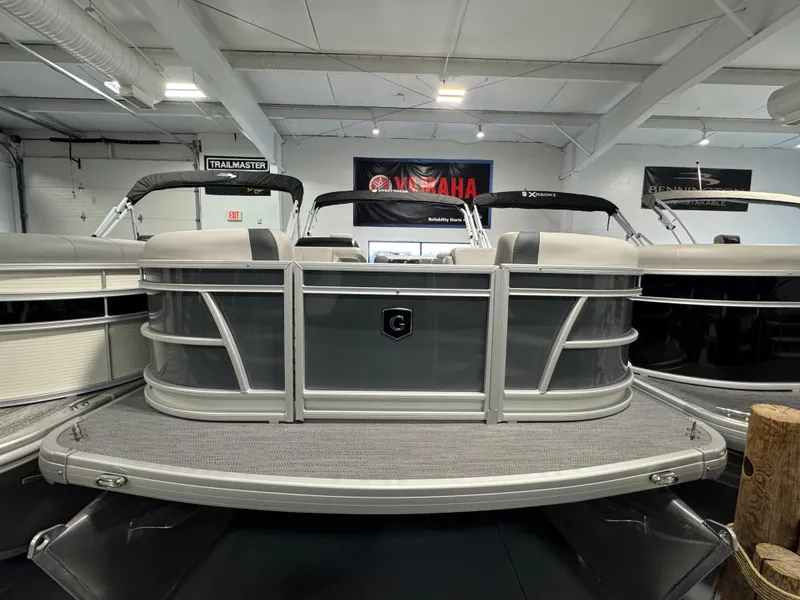 Slide: The Image of 2025 Godfrey Sweetwater 2086 C pontoon boat in showroom, front view. - 2