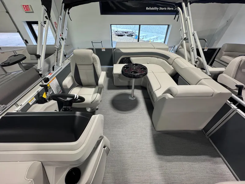 Slide: The Image of Interior of 2025 Godfrey Sweetwater 2086 C pontoon boat with plush seating and steering console. - 6