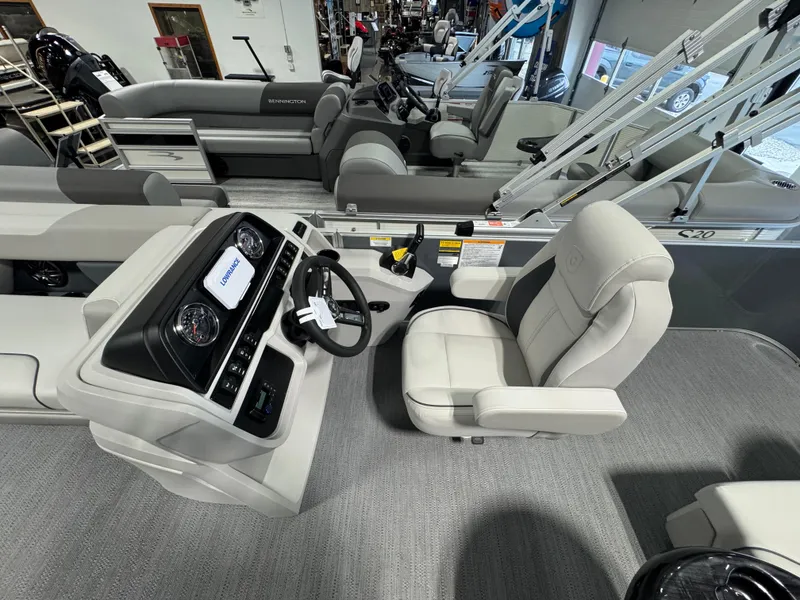 Slide: The Image of 2025 Godfrey Sweetwater 2086 C boat interior with steering console and seating. - 7