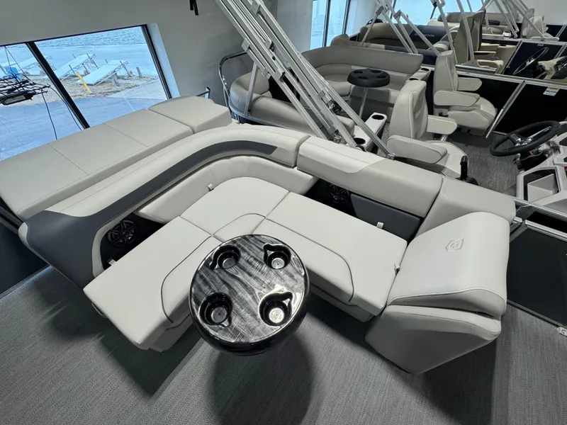 Slide: The Image of Interior of 2025 Godfrey Sweetwater 2086 C pontoon boat with plush seating and table. - 9