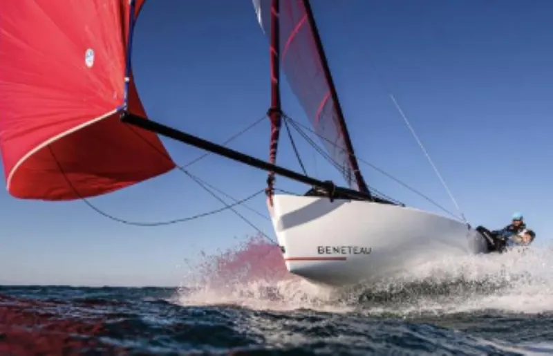 Slide: The Image of 2025 Beneteau First 18 SE sailboat gliding swiftly on open water. - 5