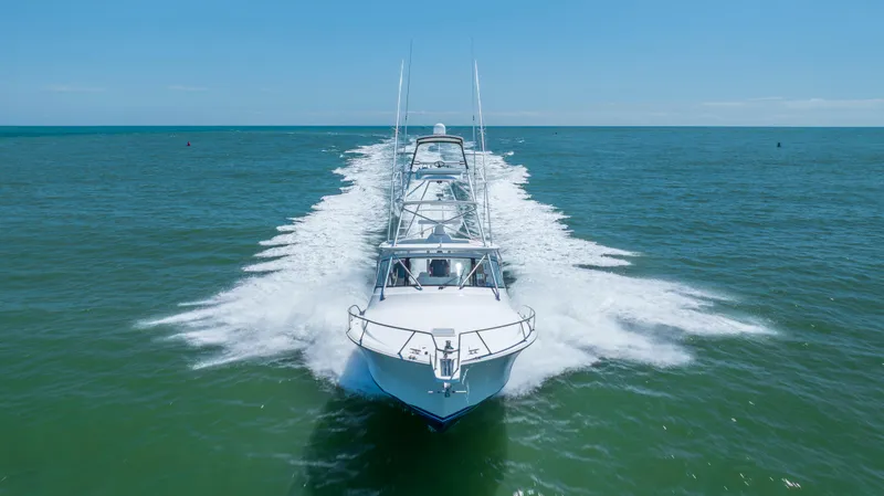 Slide: The Image of Viking 42 yacht cruising on open sea, 2013 model, creating a dynamic water trail. - 10