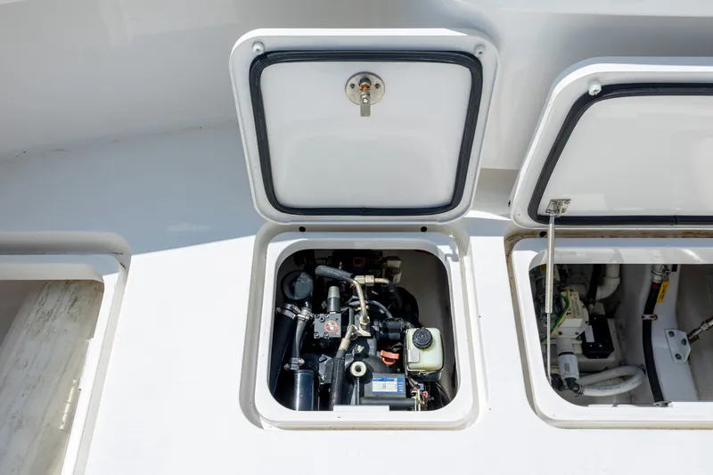 Slide: The Image of Open engine compartment of 2013 Viking 42 boat, showcasing mechanical components. - 18