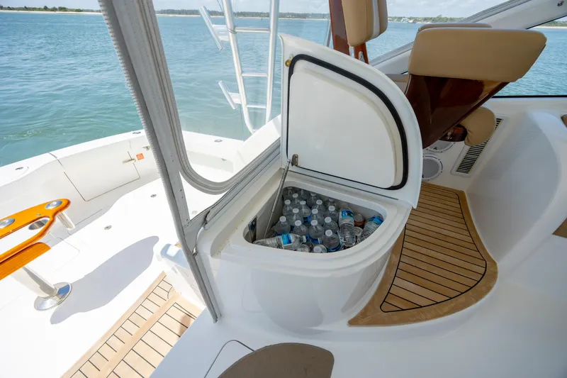 Slide: The Image of Open cooler with bottled water on 2013 Viking 42 yacht deck. - 23