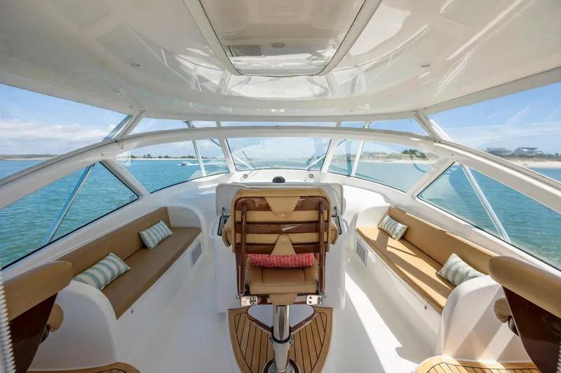 Slide: The Image of Luxurious 2013 Viking 42 yacht interior with panoramic windows and plush seating. - 24