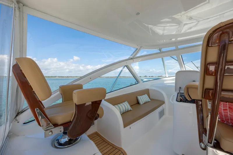 Slide: The Image of Luxurious interior of 2013 Viking 42 yacht with plush seating and ocean view. - 29