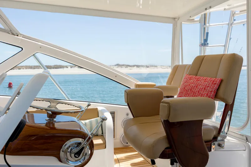 Slide: The Image of Luxurious 2013 Viking 42 yacht interior with plush seating and ocean view. - 30