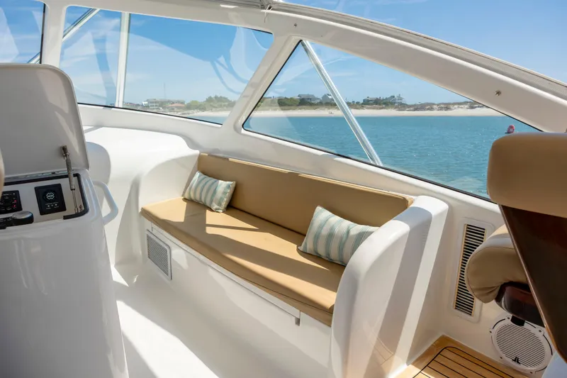 Slide: The Image of Interior of 2013 Viking 42 yacht with beige seating and ocean view. - 31