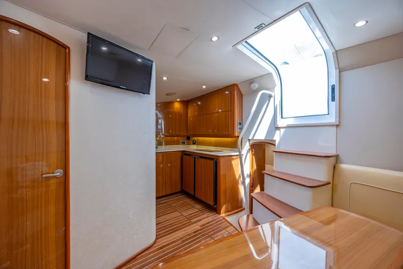 Slide: The Image of Luxurious interior of 2013 Viking 42 yacht with wooden cabinetry and modern amenities. - 35