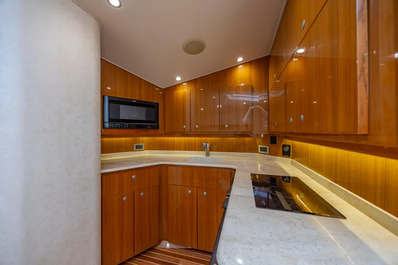 Slide: The Image of Luxurious kitchen interior of 2013 Viking 42 yacht with wooden cabinets and modern appliances. - 41