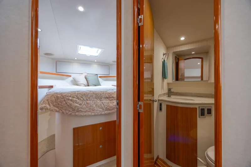 Slide: The Image of Luxurious 2013 Viking 42 yacht interior with cozy bedroom and modern bathroom. - 42