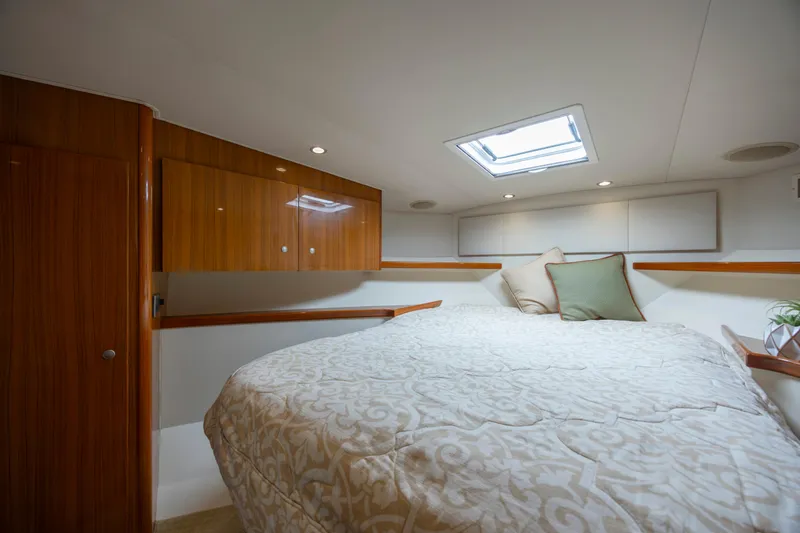 Slide: The Image of Luxurious cabin interior of 2013 Viking 42 yacht with skylight and elegant bedding. - 46