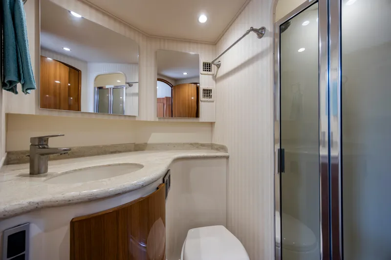 Slide: The Image of Luxurious bathroom in a 2013 Viking 42 yacht, featuring modern fixtures and elegant design. - 47