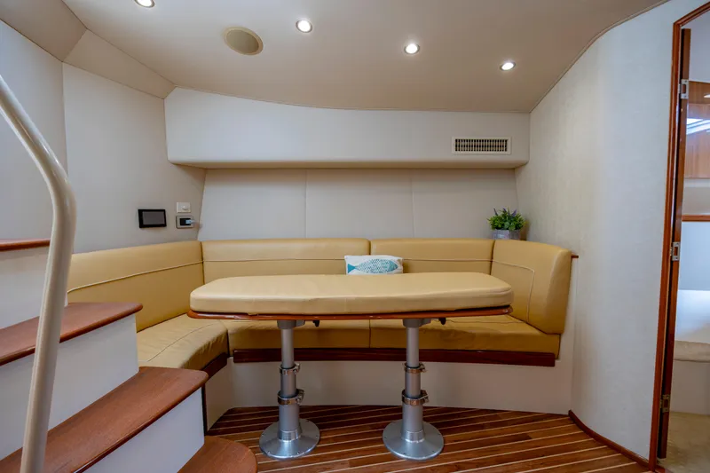 Slide: The Image of Luxurious interior of 2013 Viking 42 yacht with cozy seating and elegant table. - 49