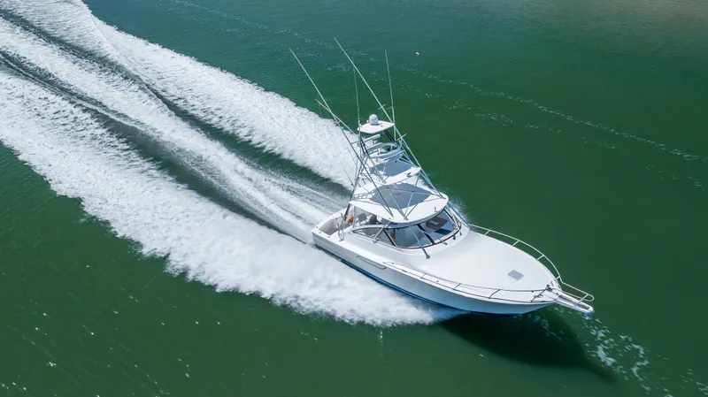 Slide: The Image of Aerial view of 2013 Viking 42 yacht cruising on open water. - 6