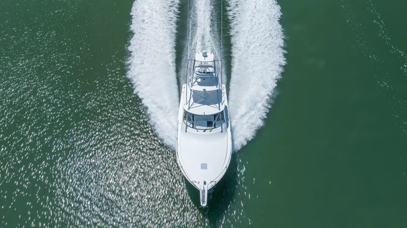 Slide: The Image of Aerial view of 2013 Viking 42 yacht cruising on open water. - 7