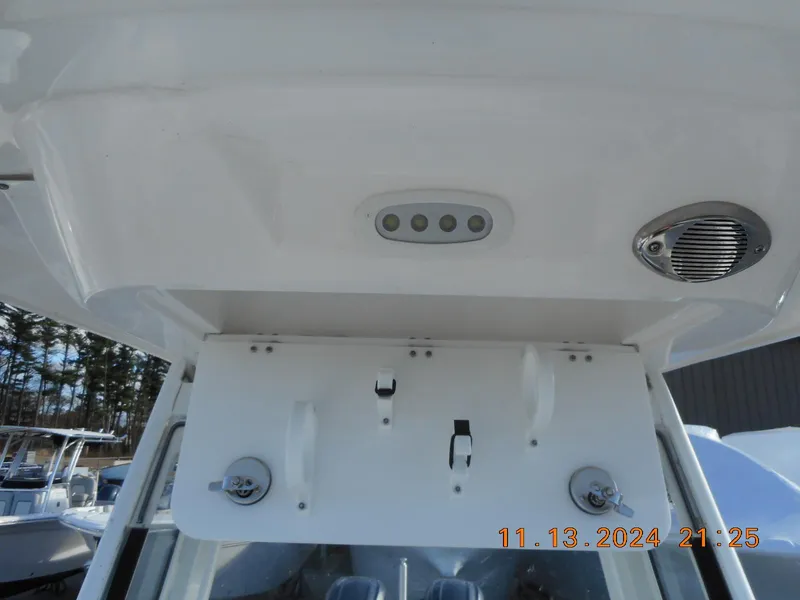 Slide: The Image of Sea Fox 268 Commander 2025 boat console with rod holders and speaker. - 25
