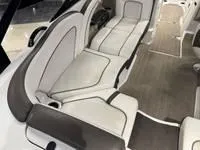 Slide: The Image of 2016 Scarab 255 H.O. Platinum boat interior with white and gray seating. - 13