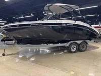 Slide: The Image of 2016 Scarab 255 H.O. Platinum boat on trailer in indoor showroom. - 2