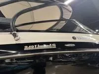 Slide: The Image of 2016 Scarab 255 H.O. Platinum boat, black and white exterior, indoor display. - 4