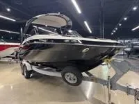 Slide: The Image of 2016 Scarab 255 H.O. Platinum boat on trailer in showroom. - 5