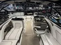 Slide: The Image of Interior of 2016 Scarab 255 H.O. Platinum boat, featuring sleek seating and modern dashboard. - 6