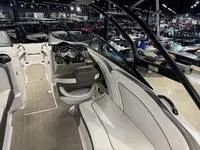 Slide: The Image of Interior of a 2016 Scarab 255 H.O. Platinum boat, showcasing seating and dashboard. - 8
