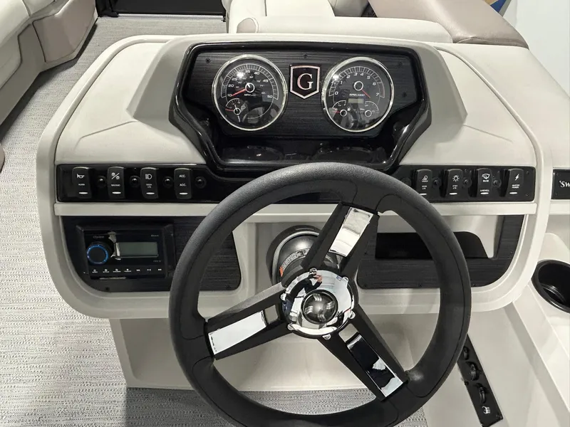 Slide: The Image of Steering console of 2025 Godfrey SWEETWATER 2286 SFL boat with gauges and controls. - 10