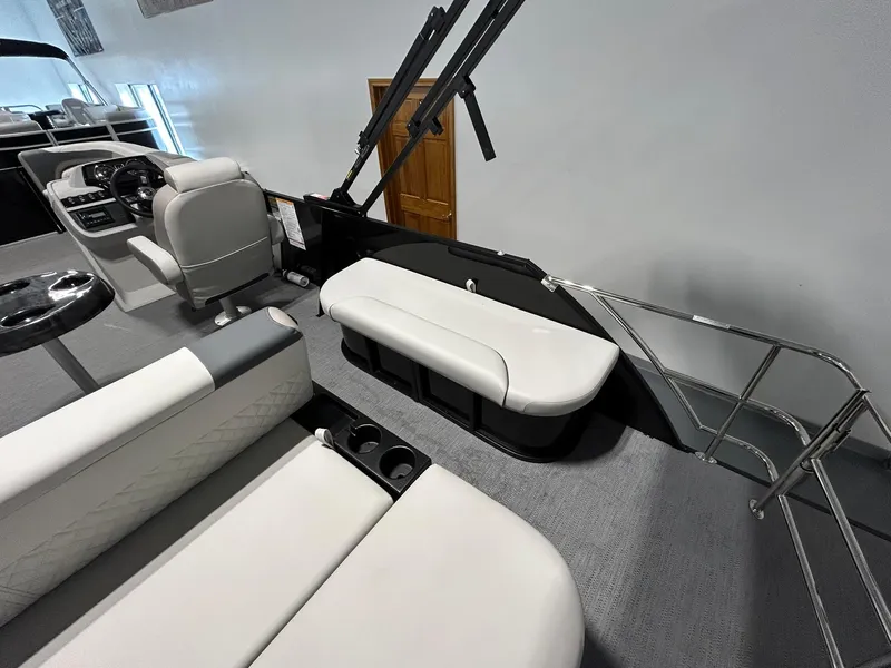 Slide: The Image of Interior of 2025 Godfrey SWEETWATER 2286 SFL pontoon boat with white seating and helm. - 13