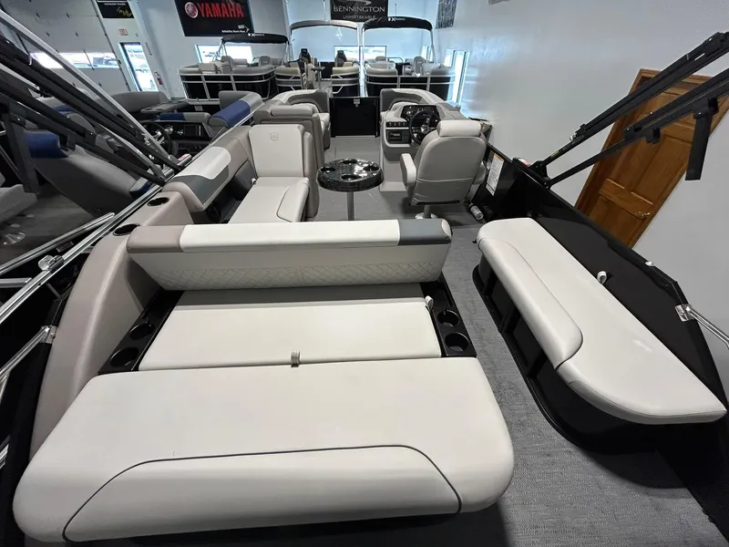 Slide: The Image of 2025 Godfrey SWEETWATER 2286 SFL pontoon boat interior with plush seating and modern design. - 14