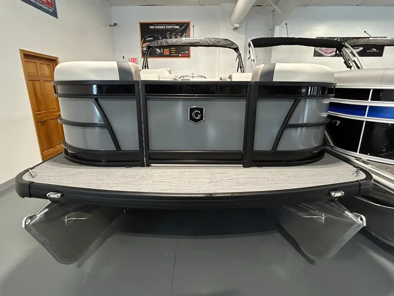 Slide: The Image of 2025 Godfrey SWEETWATER 2286 SFL pontoon boat displayed in showroom. - 2