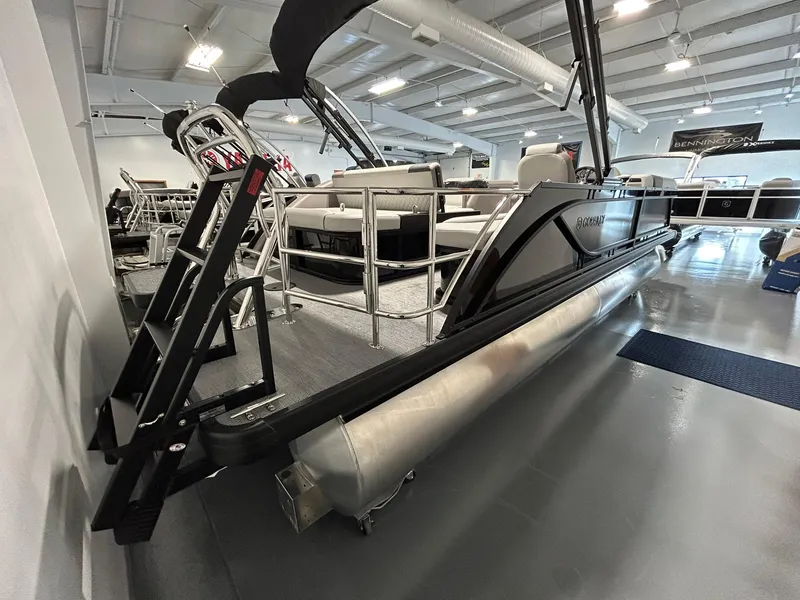 Slide: The Image of 2025 Godfrey SWEETWATER 2286 SFL pontoon boat in showroom, side view. - 3