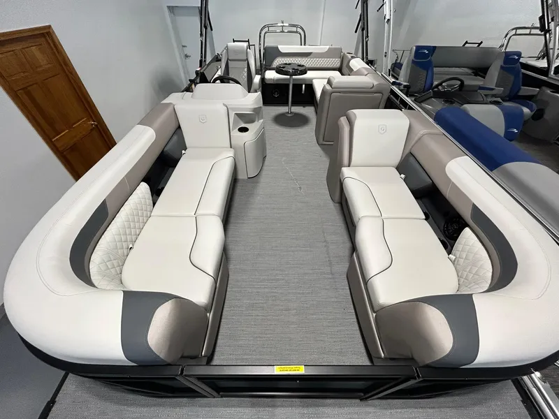 Slide: The Image of 2025 Godfrey SWEETWATER 2286 SFL pontoon boat interior with plush seating and modern design. - 4