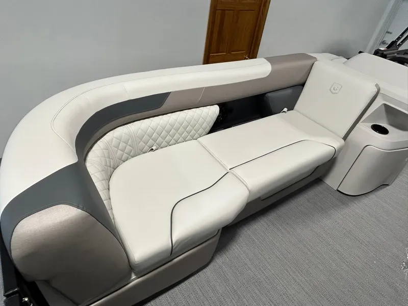 Slide: The Image of 2025 Godfrey SWEETWATER 2286 SFL boat interior with plush seating and modern design. - 6