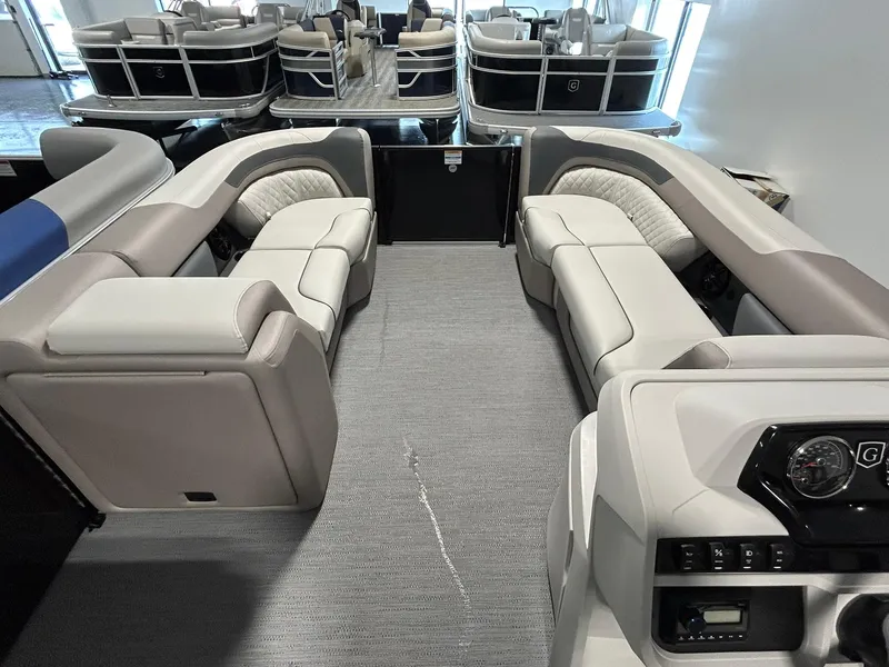 Slide: The Image of 2025 Godfrey SWEETWATER 2286 SFL pontoon boat interior with plush seating and modern dashboard. - 7